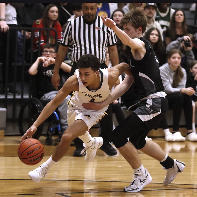 Crystal Lake South's AJ Demirov drives the baseline against Kaneland's Brad Franck during the IHSA Class 3A Kaneland Boys Basketball Sectional championship game on Friday, March 1, 2024, at Kaneland High School in Maple Park.