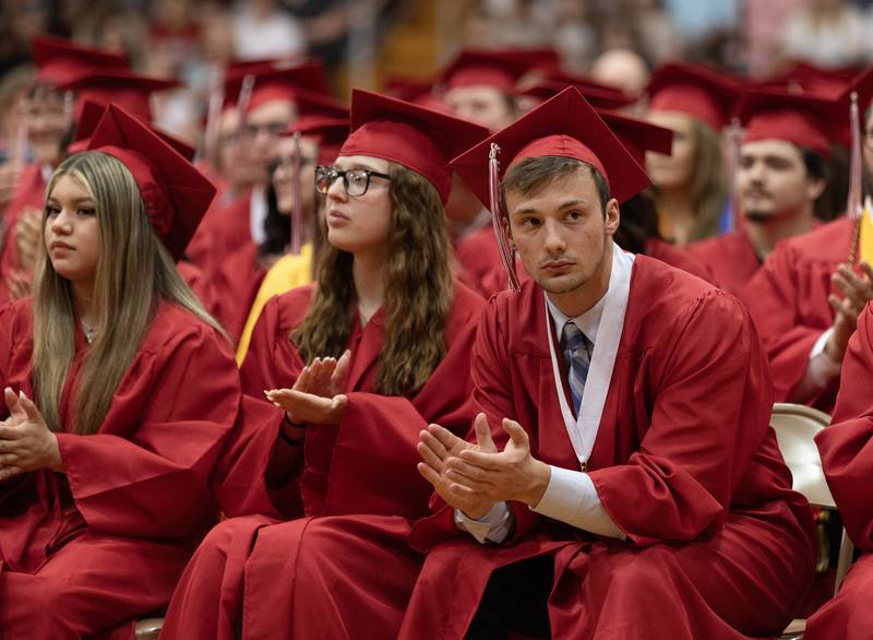 Streator High School graduate Christian Benning applauds for a classmate's speech during the Sunday, May 19, 2024, graduation ceremony.