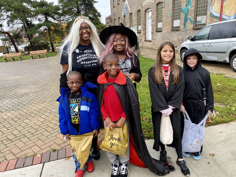 (Front row from left) Kareem Ali, 5, and his brother James Ali, 7, of DeKalb, dressed as vampires, while (back row from left) joined by mom Chimarra Ali and sister Chimeena Ali, 10, dressed as a witch, along with (right) Caroline Sullivan, 9, and Jacob Parker, 8, of DeKalb. The group enjoyed trick-or-treating in downtown DeKalb Thursday, Oct. 26, 2023 for the 26th annual Spooktacular hosted by the DeKalb Chamber of Commerce.