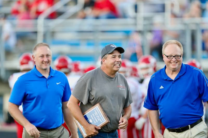 Dr. Rich Halberg (center) was inducted into the Princeton High School Academic Hall of Fame before Friday's game at Bryant Field.