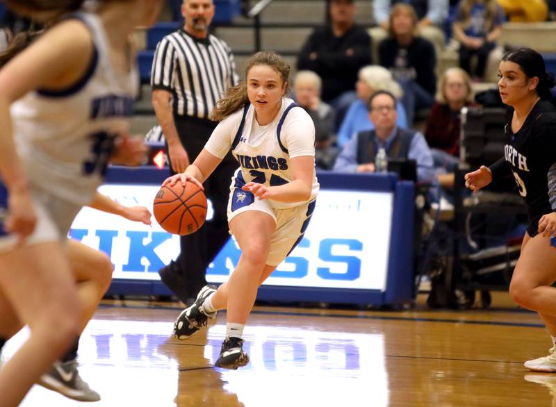 Geneva’s Kinsey Gracey drives toward the basket during a game against St. Charles North at Geneva on Tuesday, Feb. 6, 2024.