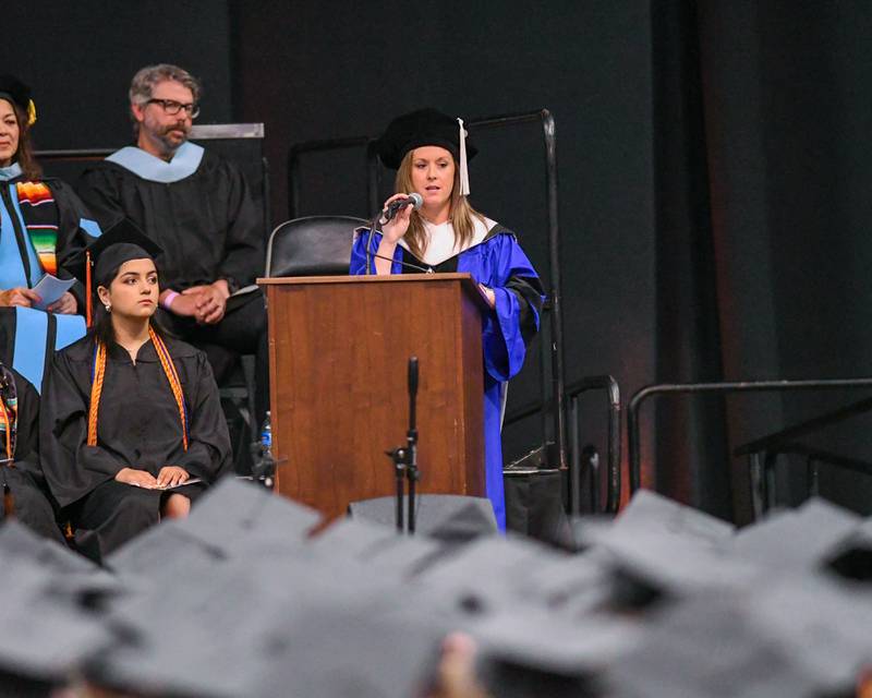 DeKalb High School principal Donna Larson gives her commencement speech during the DeKalb High School 2024 Commencement held at the NIU Convocation Center in DeKalb.