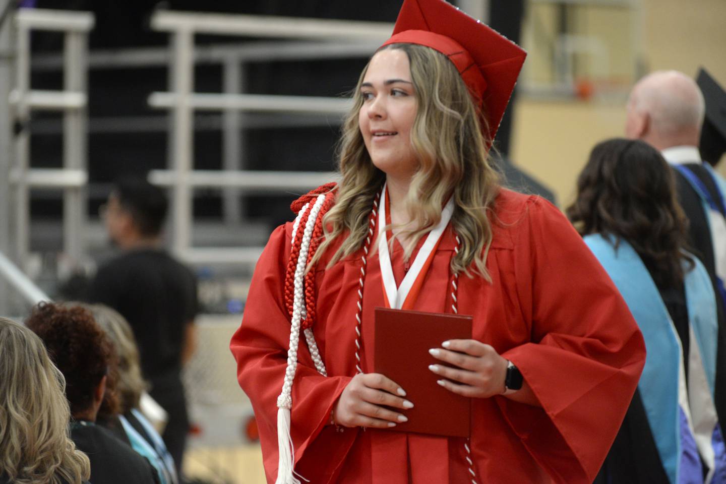 Peyton Sadler smiles after crossing the stage during Oregon High School's commencement on Sunday, May 19, 2024.