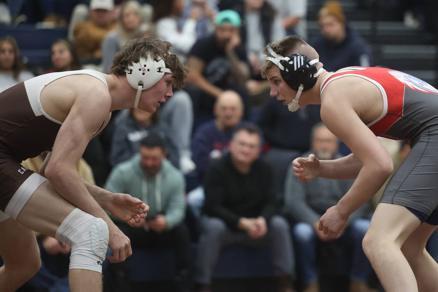 Marian Central’s Jimmy Mastny (right) faces off with Eddie Enright of Mt. Carmel in the tri-meet at Joliet Catholic on Thursday, Jan. 18th, 2024 in Joliet.