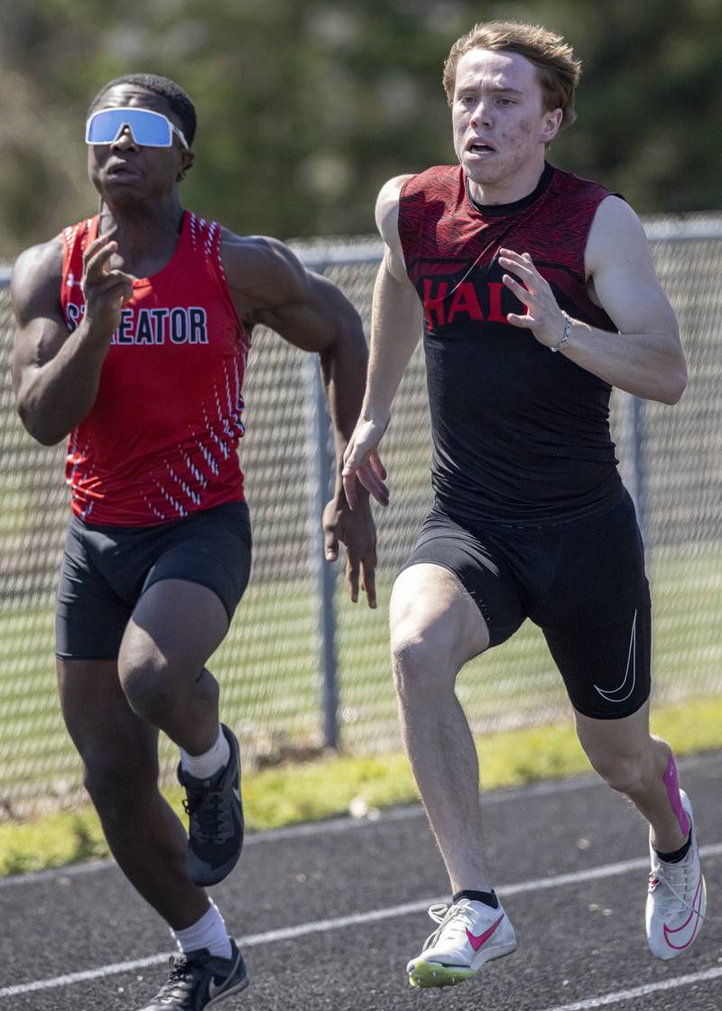 Caleb Bickett (Hall) battles it out with Isiah Brown (Streator) in the men's 100 meter sprint during the Rollie Morris Invite at Hall High School on April 13, 2024. They both posted an 11.1 second time with Brown just edging out Bickett for the win.