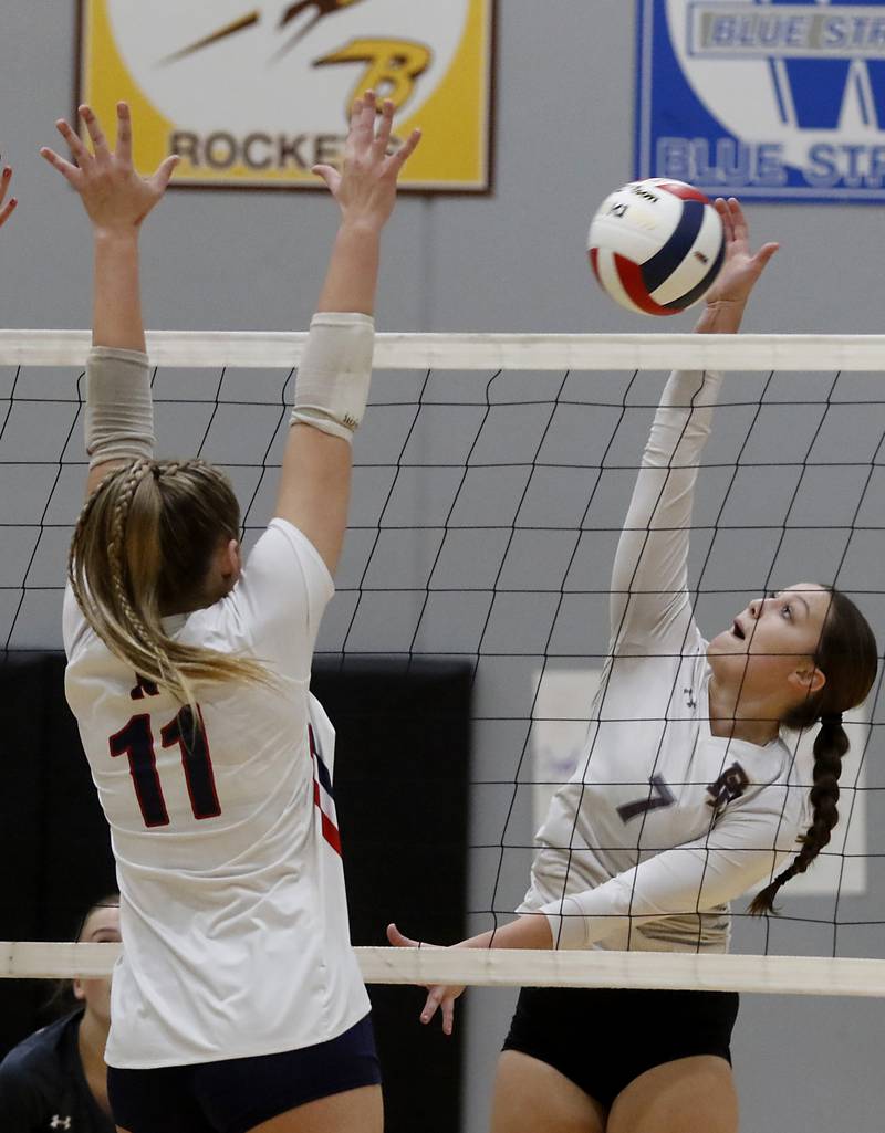 Prairie Ridge's Addison Gertz tries to hit the ball past Belvidere North's Riley Johnson during the Class 3A Woodstock North Sectional finals volleyball match on Wednesday, Nov. 1, 2023, at Woodstock North High School.