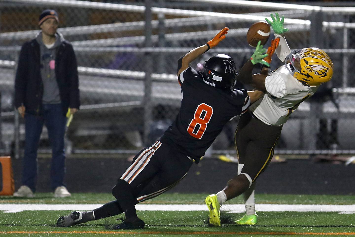 McHenry's Jeffry Schwab and Jacobs' PJ Barnes battle for the ball during a Fox Valley Conference football game on Friday, Oct. 18, 2024, at McCracken Field in McHenry.