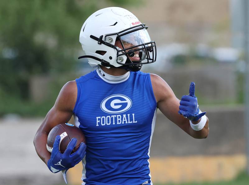 Geneva’s Talyn Taylor gives a thumbs up to teammates after catching a touchdown pass during their matchup with Kaneland in the July 2024 Kaneland 7-on-7 at the school in Maple Park.