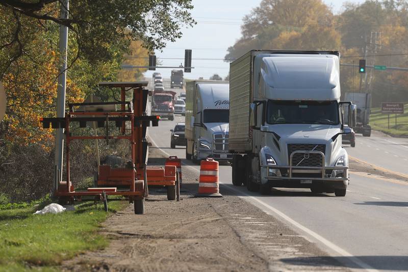 Trucks travel along South Chicago Street on Tuesday, Oct. 24 in Joliet.