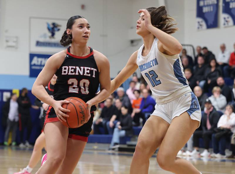 Benet’s Emma Briggs (20) goes to the basket against Nazareth during a girls varsity basketball game on Monday, Jan. 29, 2024 in La Grange Park, IL.