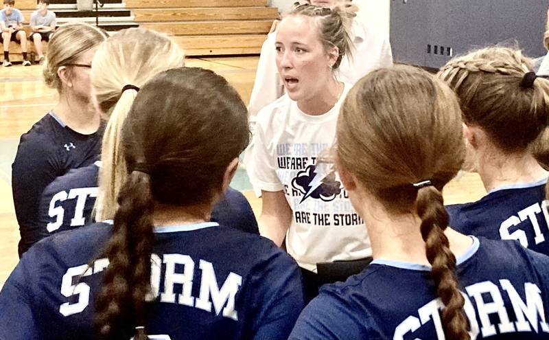 Bureau Valley coach Saige Barnett huddles with the Storm during Monday's season-opener with Riverdale. The visiting Rams rallied late to take Game 1 25-23 and finished off the nonconference victory 25-18 in Game 2.