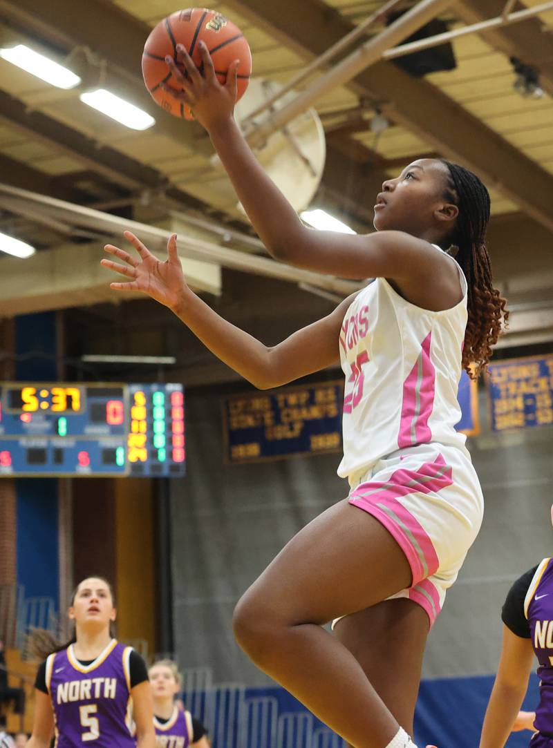 Lyons’ Nora Ezike lays up against Downers Grove North during the girls varsity basketball game on Tuesday, Jan. 16, 2024 in La Grange, IL.