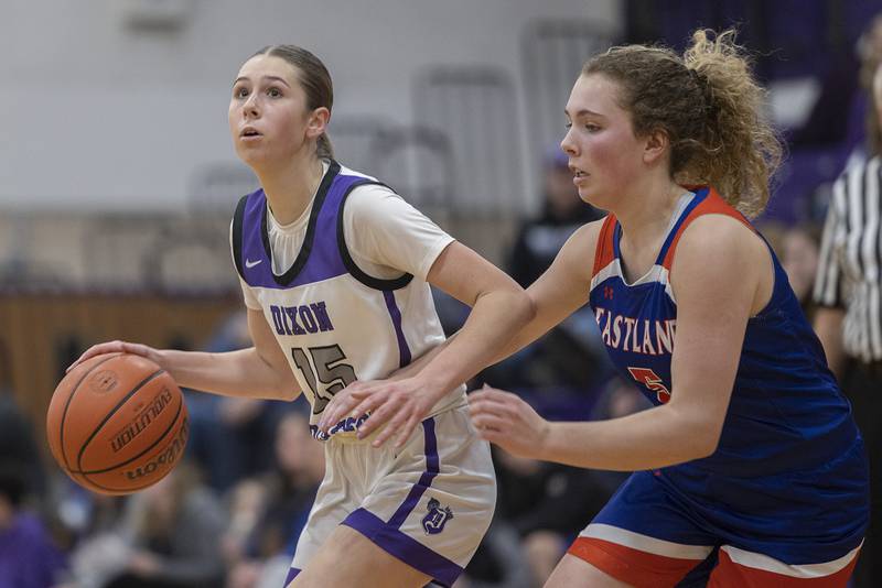 Dixon’s Morgan Hargrave handles the ball against Eastland’s Jenica Stoner Wednesday, Jan. 24, 2024 at Dixon High School.