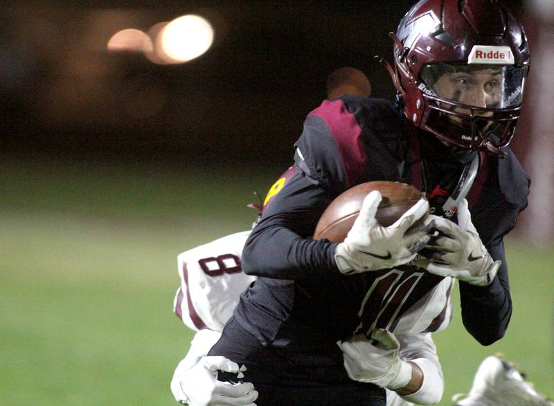 Marengo’s Alten Bergbreiter runs with the ball against Richmond Burton in varsity football at Rod Poppe Field on the campus of Marengo High School in Marengo on Friday, Oct. 18, 2024.