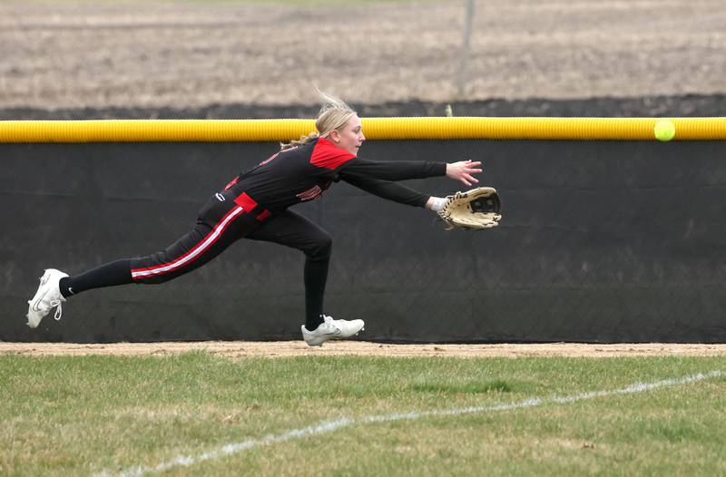 Indian Creek’s Gretta Oziah tries to run down a fly ball during their game against Mendota Thursday, March 14, 2024, at Indian Creek High School in Shabbona.