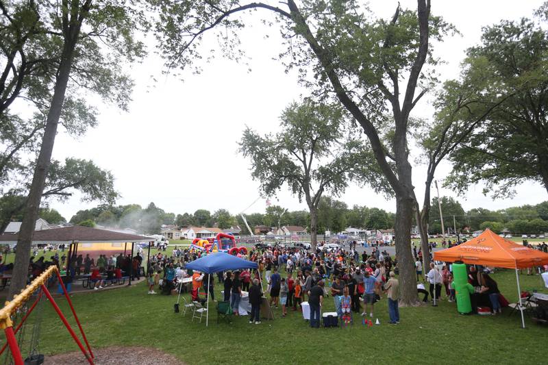 A large crowd attends the National Night Out event on Tuesday, Aug. 6, 2024 at Kirby Park in Spring Valley.