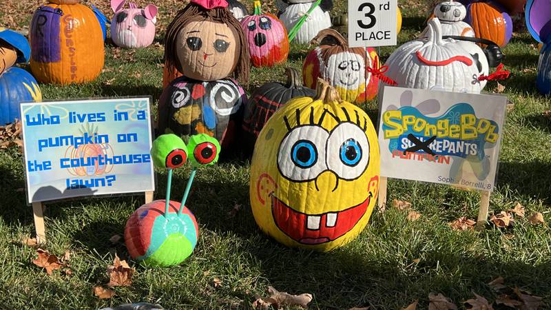 A SpongeBob SquarePants pumpkin, along with a Gary the Snail pumpkin, sit with the pumpkins on display at the DeKalb County Courthouse for the Sycamore Pumpkin Festival on Oct. 28, 2022.