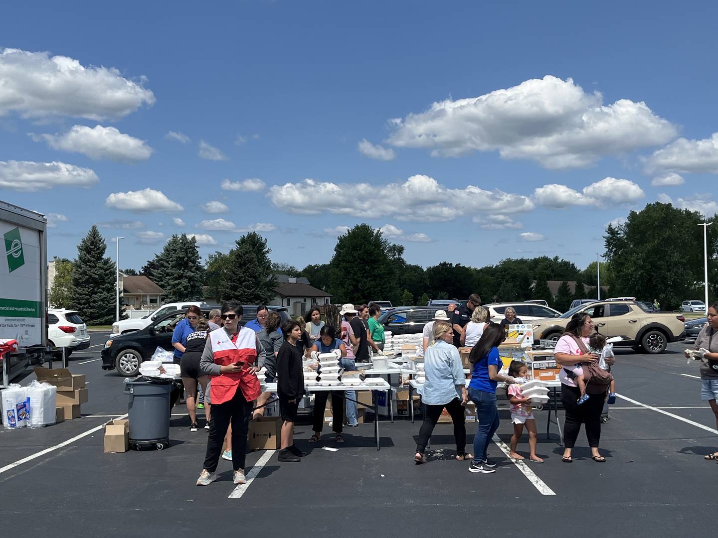 Volunteers at a food distribution event on Thursday, July 18, 2024, at Victory City Church in Joliet. The church partnered with Joliet city officials and American Red Cross to help residents who've been affected by the storms on Monday, July 15, 2024.