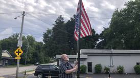 Upside-down flag stolen from Woodstock yard after prompting responses from strangers, owner says