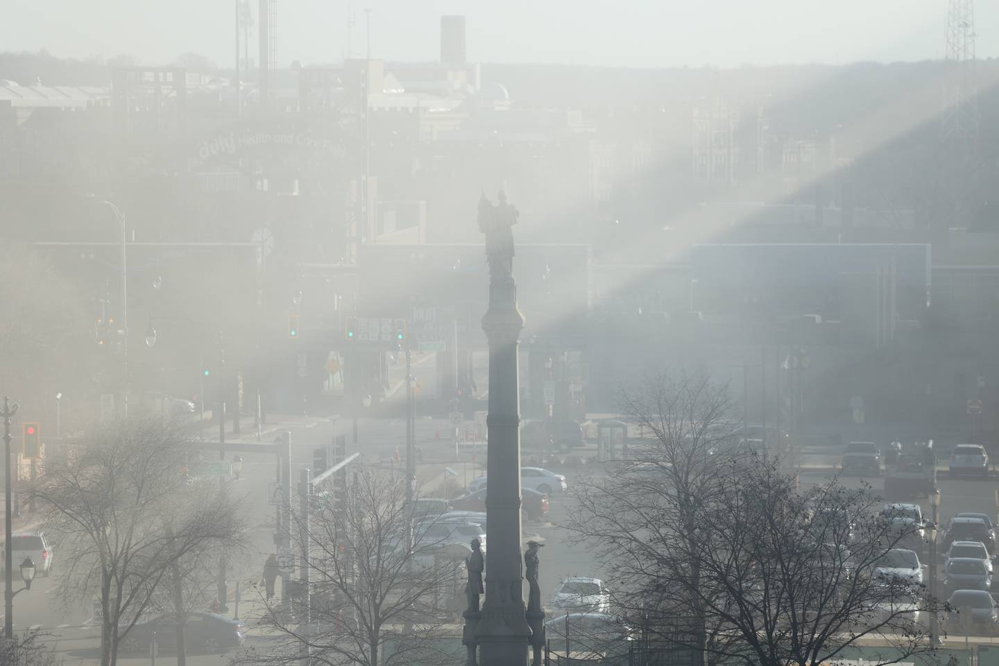 Dust creates a silhouette of the popular statue outside the old Will County Courthouse as it is gutted and ready for the external demolition which is expected to happen on Monday, Feb. 12th 2024 in Joliet.