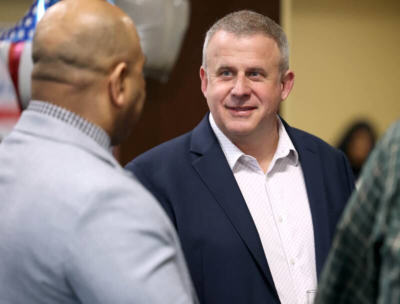 Cohen Barnes, DeKalb mayor and candidate for the democratic nomination for the 76th district seat in the Illinois House of Representatives, talks to DeKalb Police Chief David Byrd Tuesday, March 19, 2024, during Barnes’ election night party at Faranda’s in DeKalb.