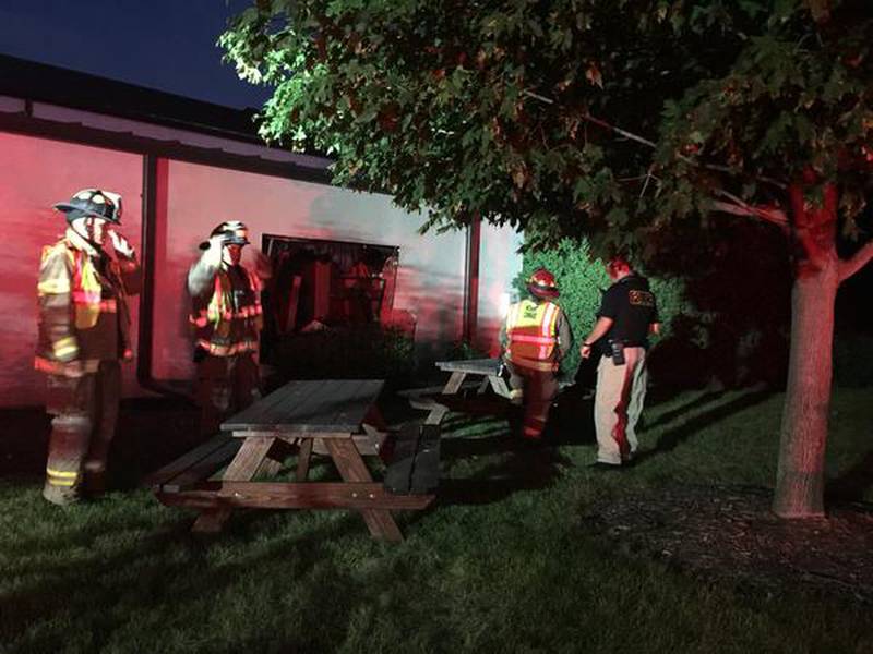 Crystal Lake Fire Rescue works on the scene at Hope Church after a vehicle drove into the side of 
the building.