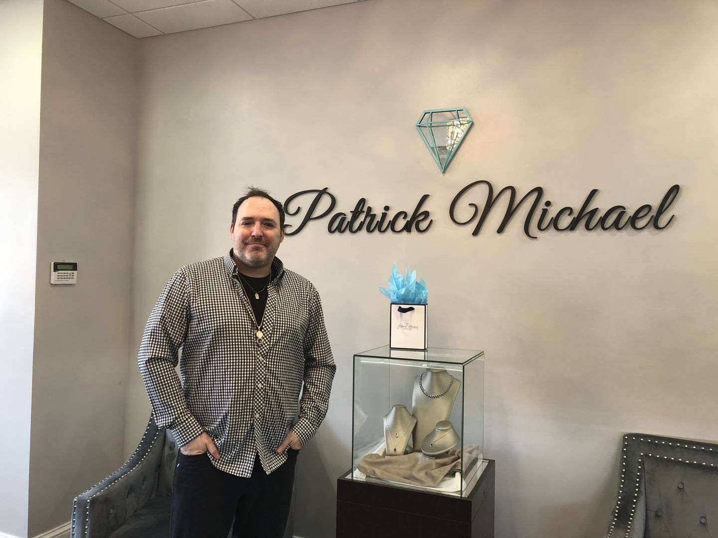 Patrick Michael of Patrick Michael Jewelers poses inside the store Feb. 22, 2024