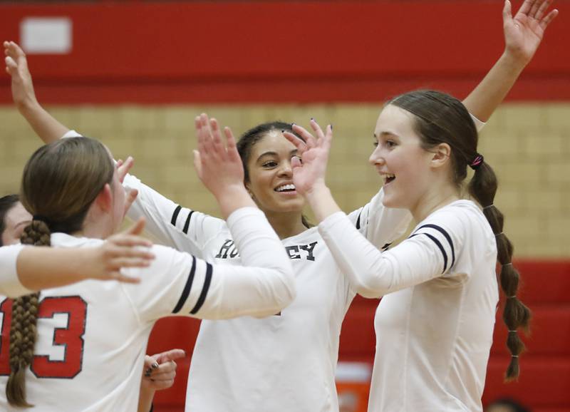 Huntley's Laura Boberg, (left) Morgan Jones and Jocelyn Erling celebrate a point during the IHSA Class 4A Rockford East Regional Volleyball Championship match against Dundee-Crown on Thursday, Oct. 26, 2023, at Rockford East High School.
