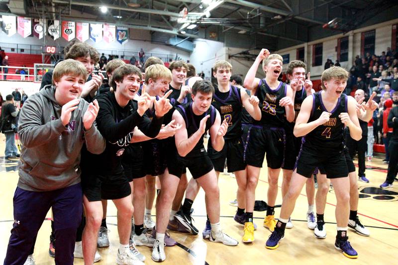 Downers Grove players celebrate their win over Bolingbrook in the Class 4A East Aurora Boys Basketball Sectional final on Friday, March 1, 2024.