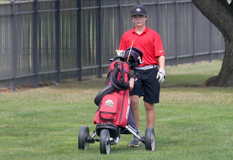 Ottawa's Joshua Armstrong pushes his cart down the green during the Pirate Invitational golf meet on Monday, Sept. 16, 2024 at Deer Park Golf Course in Oglesby.