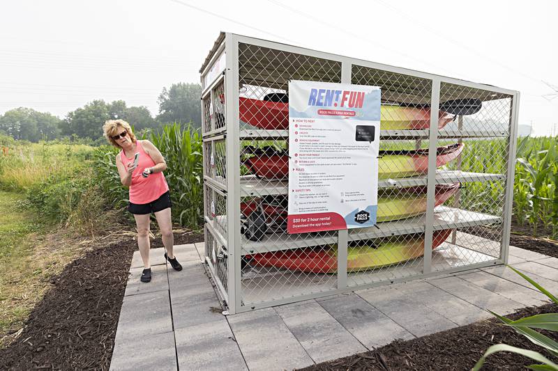 Rock Falls Tourism’s Melinda Jones demonstrates the self-service kayak kiosk near the Route 40 Hennepin Canal launch area Wednesday, June 28, 2023.