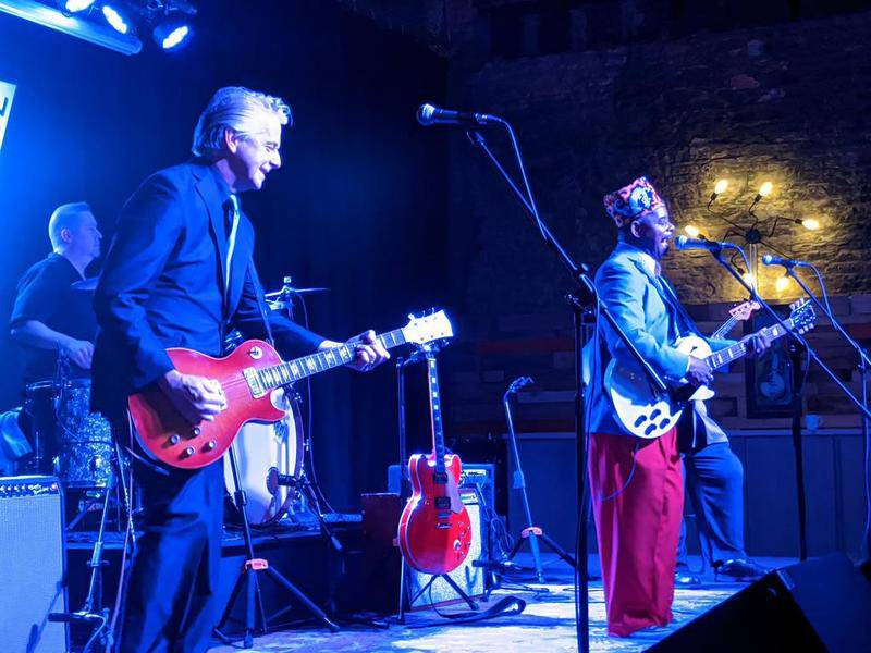 Lil' Ed Williams, frontman for the group Lil' Ed and The Blues Imperials, trades licks with guitarist Mike Garrett, left, during a show at The Venue in Aurora.