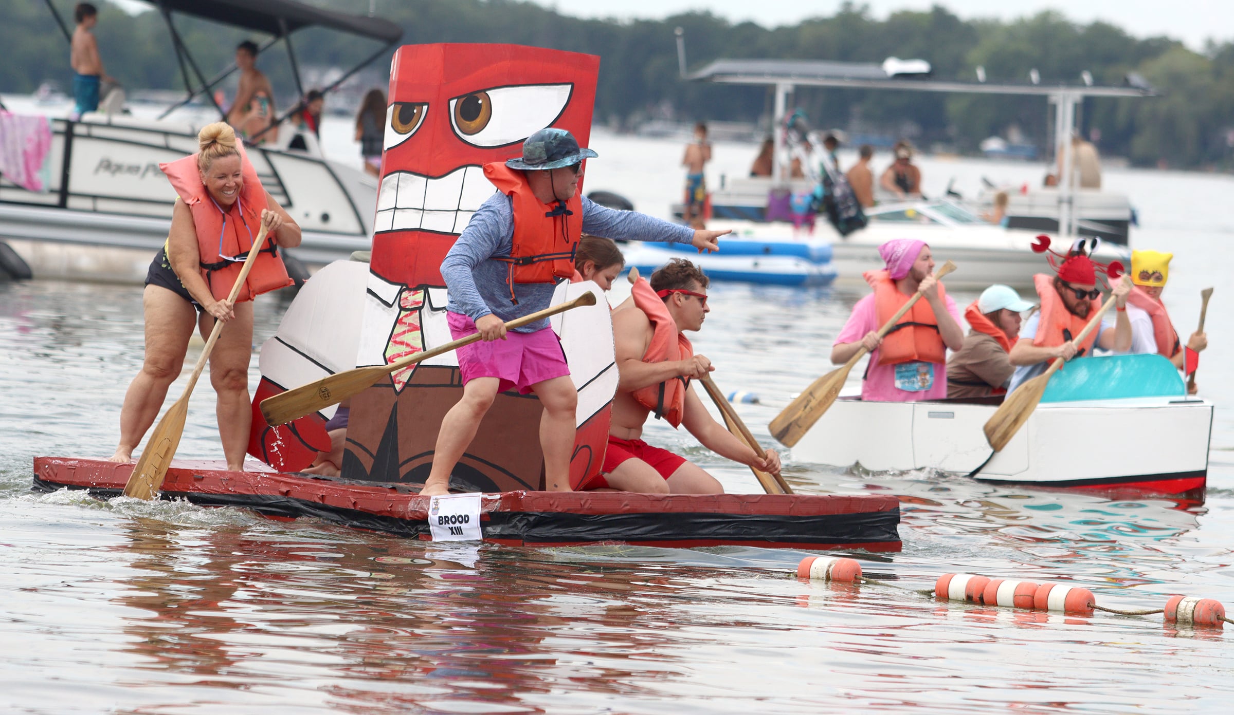 The team from Brood XIII reaches open water during the Cardboard Regatta on Crystal Lake Saturday.