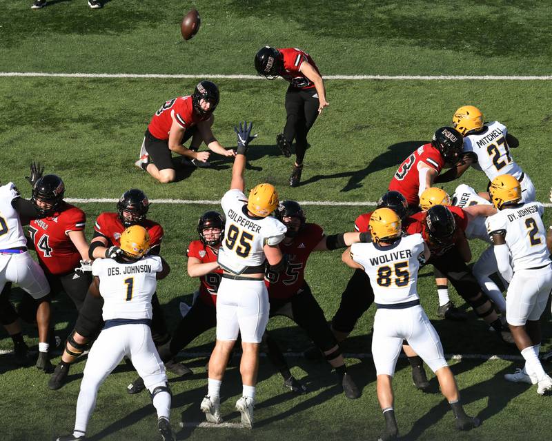 Northern Illinois Huskies Kicker John richardson makes an extra point in the first quarter while taking on Toledo on Saturday Nov. 8th.