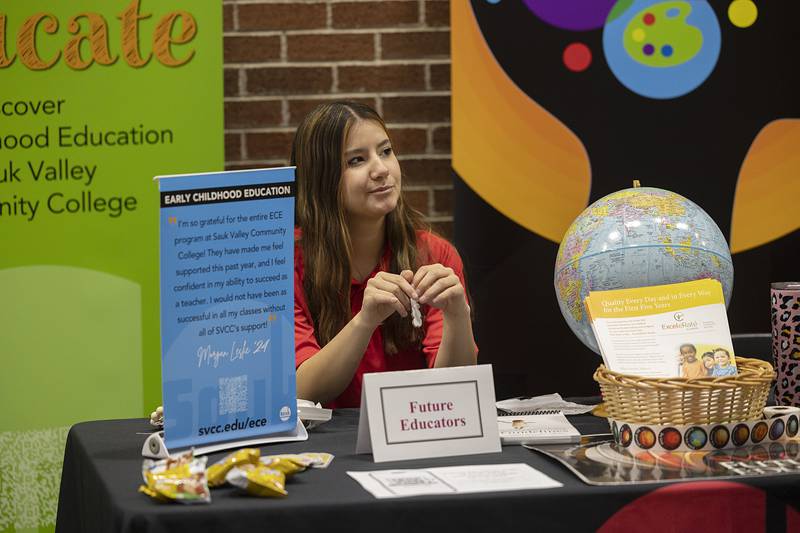 Marisa Salmon of Sterling works the early education booth at Sauk valley Community College Wednesday, Jan. 31, 2024. SVCC had several booths with information about their classes, clubs and organizations.