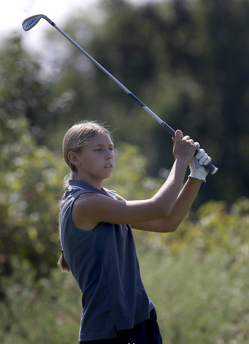 Richmond-Burton's Meadow Rosendahl watches her tee shot on the 7th hole of Valley course during the McHenry County Tournament on Thursday, Sept.12, 2024, at Boone Creek Golf Club in Bull Valley.