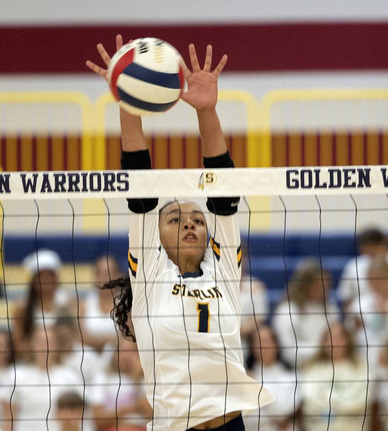 Sterling’s Nia Harris goes up for the block Tuesday, Sept. 10, 2024, during a volleyball game against Moline.