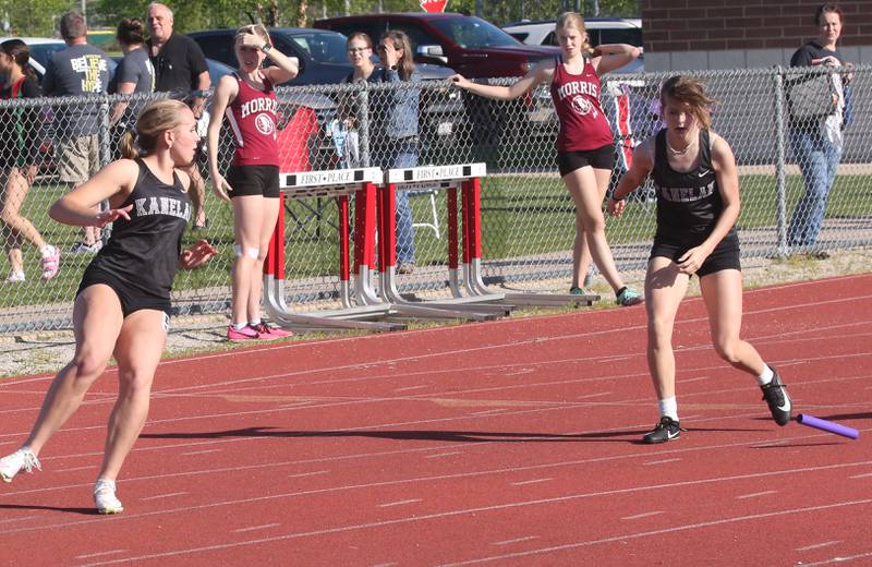 Kaneland's Alexis White looks back as teamate Linda Ray drops the baton in the 4x100 relay during the Interstate 8 conference track meet on Friday, May 3, 2024 at the L-P Athletic Complex in La Salle.