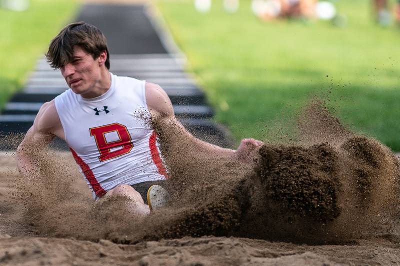 Batavia’s Eric Perkins competes in the long jump during a DuKane Conference boys track and field meet at Geneva High School on Thursday, May 11, 2023.