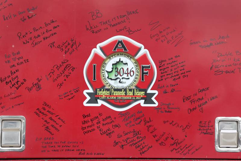 Messages written on a vintage fire truck for firefighter/paramedic Bradley Belanger Saturday, Jan. 6, 2024, during the visitation for Belanger at the Sycamore Park District Community Center. Belanger, 45, who worked with the Sycamore Fire Department for more than two decades, died Friday, Dec. 22, after a yearlong battle with cancer.