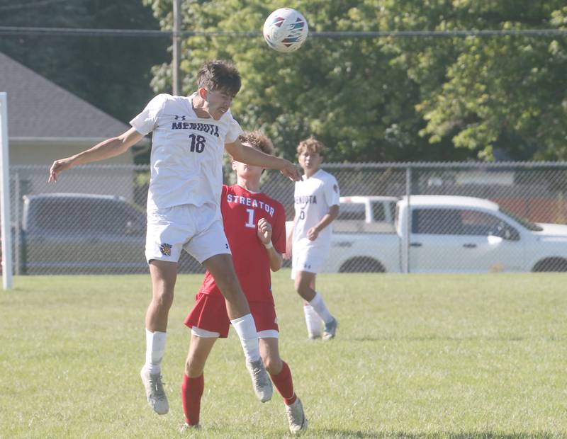 Mendota's Cameron Escatel puts a header on the ball over Streator's Issca Fowler on Saturday, Aug. 31, 2024 at James Street Recreation Area in Streator.