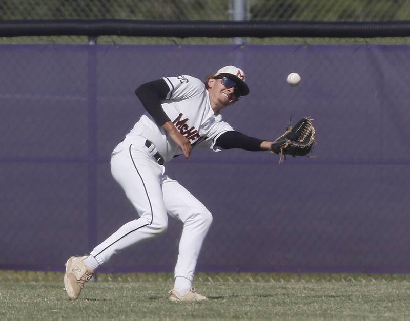 McHenry's Kadin Borck tries to field the ball during a Class 4A Hampshire sectional baseball game against Hampshire on Wednesday, May 29, 2024, at the Hampshire High School.