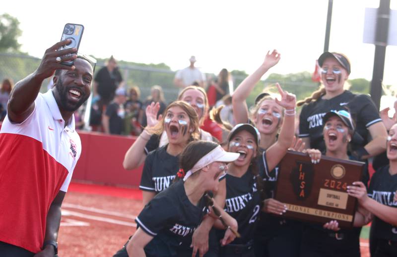 Huntley’s Red Raiders celebrate a win over Barrington in sectional final softball action at Barrington Friday.