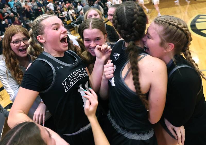 Kaneland players celebrate their win over Sycamore in their Class 3A sectional semifinal Tuesday, Feb. 20, 2024, at Sycamore High School.