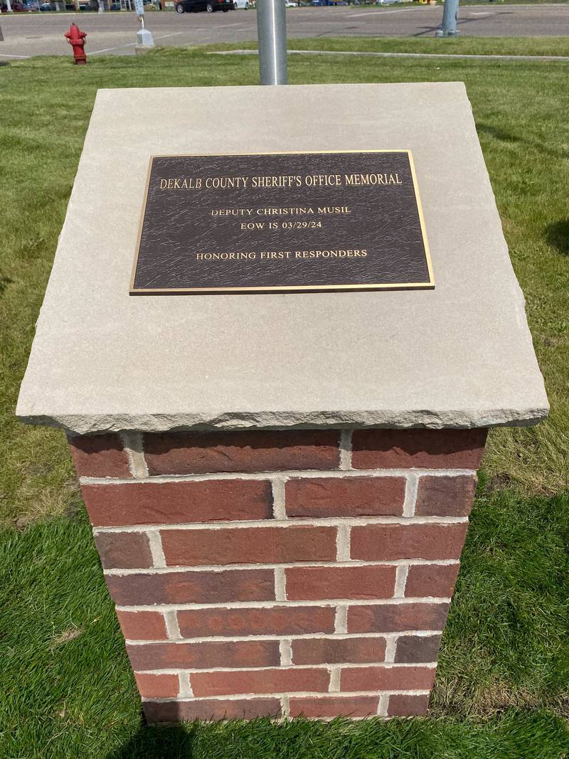 A memorial plaque was unveiled to honor late DeKalb County Sheriff's Deputy Christina Musil at the new first responders memorial outside Isaac Executive Suites, 2675 Sycamore Road, DeKalb, during a dedication ceremony held Sunday, May 19, 2024. Musil, 35, a mother of three and military veteran, was killed in the line of duty after a car crash March 28, 2024. She died from her injuries in the early morning hours March 29, 2024.