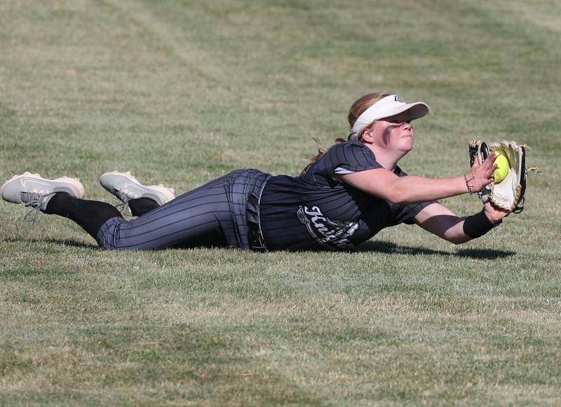 Kaneland's Isabelle Stombres makes a diving catch in center field during their Class 3A sectional semifinal against Sycamore Thursday, May 30, 2024, at Sycamore High School.