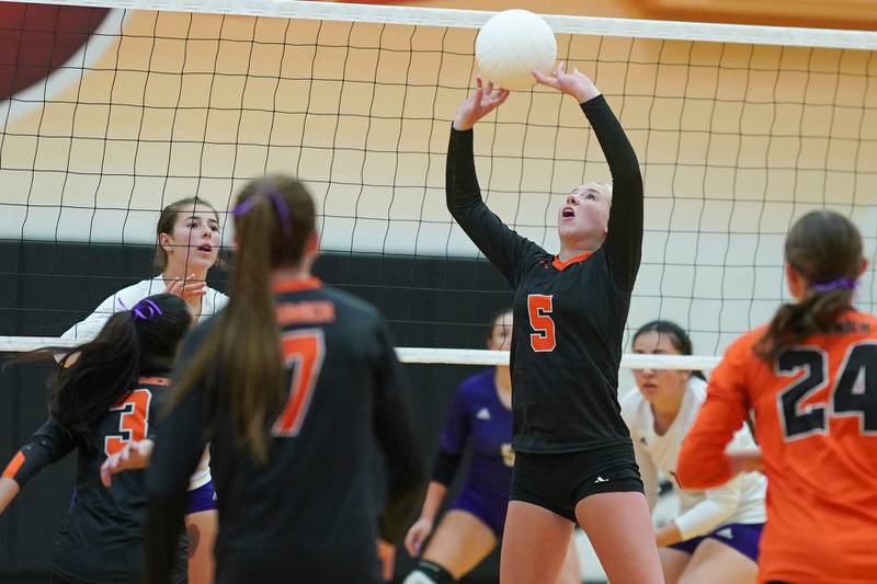 Sandwich's Jessica Ramey (5) sets the ball during a volleyball match against Plano at Sandwich High School on Tuesday, Sep 10, 2024.