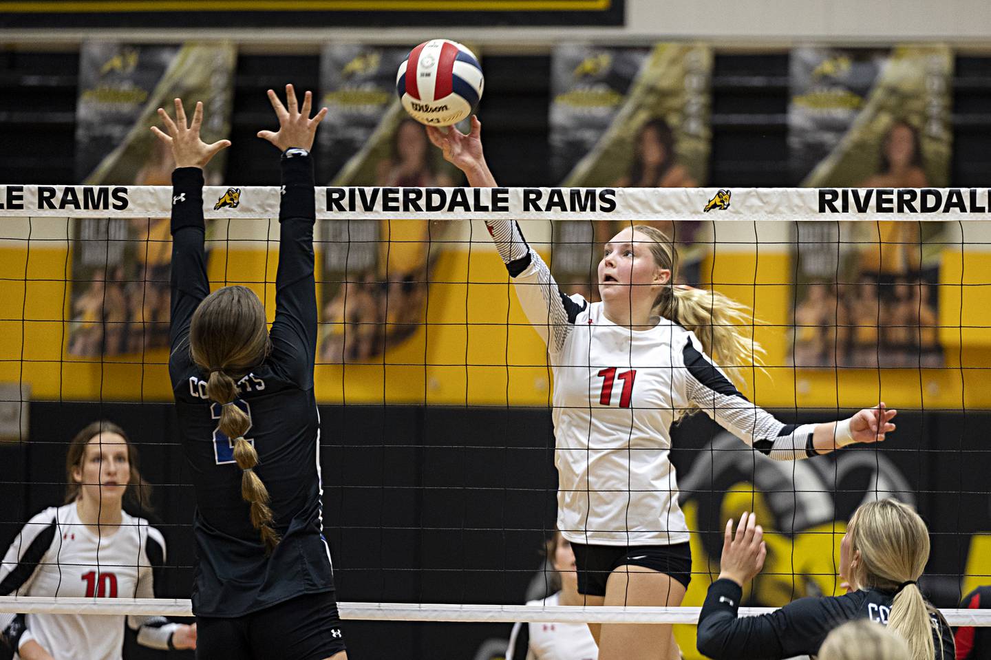 Erie-Prophetstown’s Lauren Abbott works the net against Newman Tuesday, Oct. 24, 2023 at the Riverdale volleyball regional.