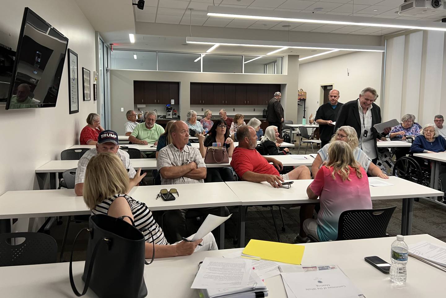 More than 50 people gathered on the second floor of the DeKalb Police Station at 700 W. Lincoln Highway on July 11, 2023 to attend a public hearing regarding the sale of the DeKalb County Rehab and Nursing Center to a private buyer.