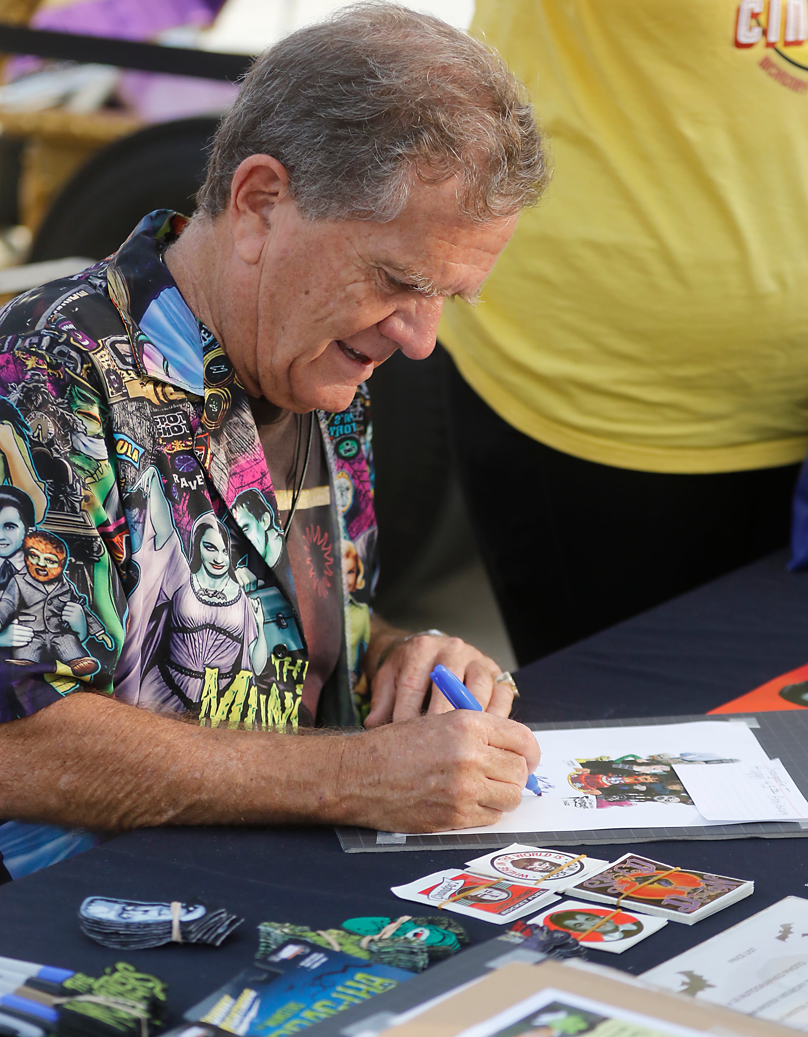 Butch Patrick, who played Eddie Munster on the 1960s show “The Munsters” signs autographs, Wednesday, Aug. 14, 2024, during an appearance at the McHenry Outdoor Theater.